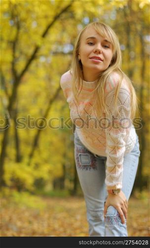 The girl on a background autumn forest. The blonde, 24 years