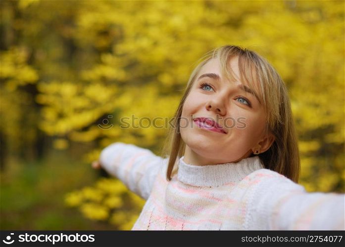 The girl on a background autumn forest. The blonde, 24 years