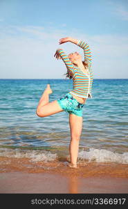 The girl poses on a beach