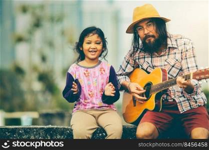 The girl sings with male musician playing guitar happy weekend