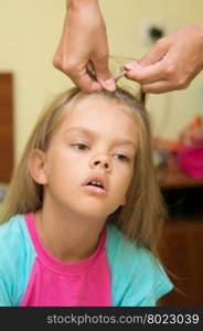 The girl with a tortured expression braided long hair