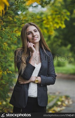 The girl with long hair autumn among nature.. Portrait of a girl in nature 3684.