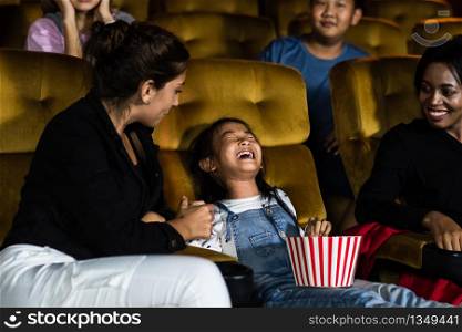 The girls cried loudly in the cinema, causing annoyance to the people sitting next to and behind them.