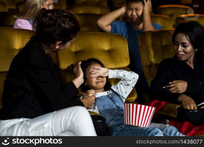 The girls cried loudly in the cinema, causing annoyance to the people sitting next to and behind them.