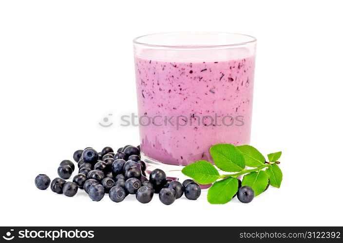 The glass of milkshake, berries and green sprig of blueberries isolated on white background