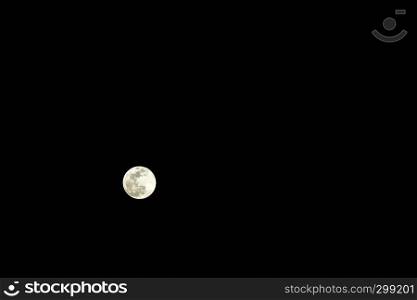 The gold super full moon isolated on black on febraury 19, 2019