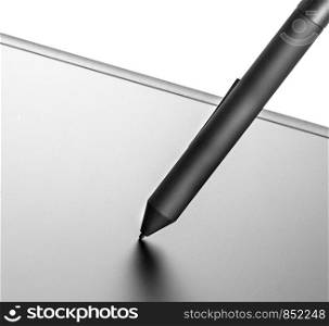 the graphic tablet with the black pencil