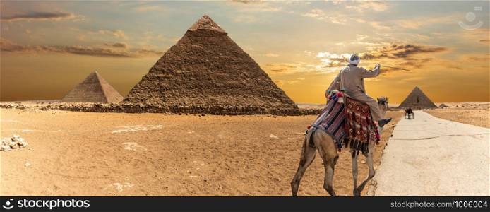 The Great Pyramids of Giza and a bedouin, desert panorama.. The Great Pyramids of Giza and a bedouin, desert panorama