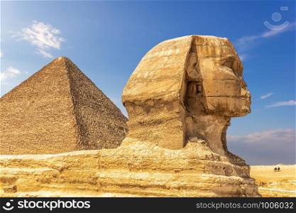 The Great Sphinx and the Pyramid of Cheops, Giza, Egypt.. The Great Sphinx and the Pyramid of Cheops, Giza, Egypt