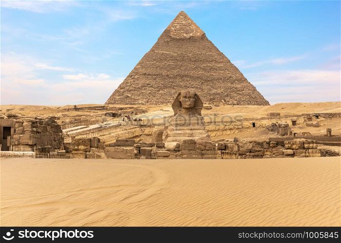The Great Sphinx of Giza in front of the Pyramid of Khafre, Egypt.. The Great Sphinx of Giza in front of the Pyramid of Khafre, Egypt