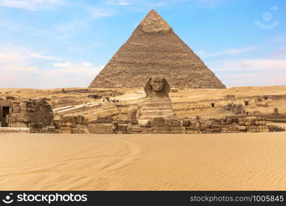 The Great Sphinx of Giza in front of the Pyramid of Khafre, Egypt.. The Great Sphinx of Giza in front of the Pyramid of Khafre, Egypt