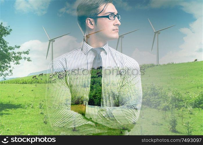 The green energy anc ecology concept with businessman. Green energy anc ecology concept with businessman