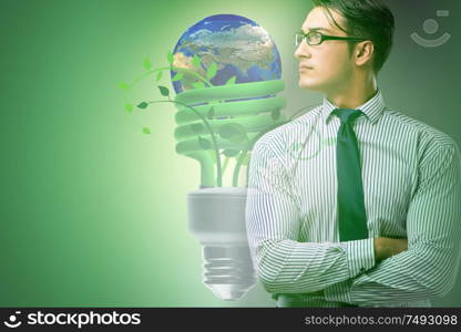 The green energy anc ecology concept with businessman. Green energy anc ecology concept with businessman