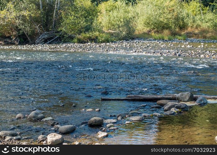The Green River in Washington State is low revealing rocks.