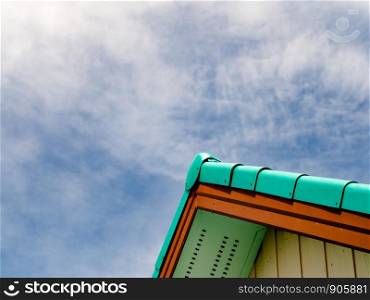 The green roof tiles with blue sky for background.
