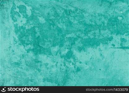 The Green vintage concrete wall abstract background. Green old paint on concrete wall or floor