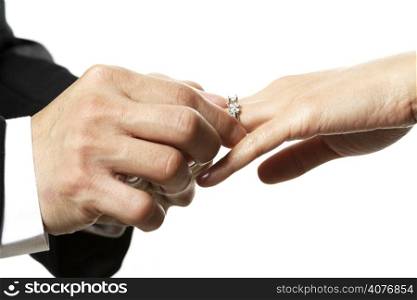 The groom and bride exchanging rings during wedding ceremony