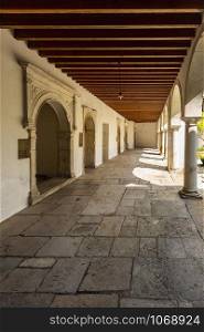 The ground floor of the Renaissance cloister and the side chapels with Romanesque capitals of the Monastery of Saint Mary of Lorvao, Coimbra, Portugal