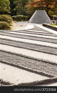 The grounds at the the Silver Pavilion complex, or Ginkakuji, in Jyoto are highlighted by a Zen garden of carefully raked sand coupled with a perfect cone-shaped mountain of sand.
