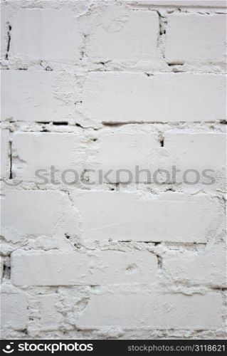 The grunge white brick wall for backgroun