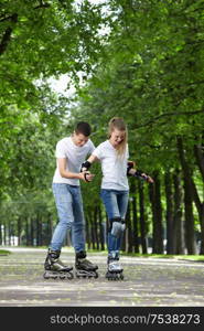 The guy and the girl go for a drive on rollers