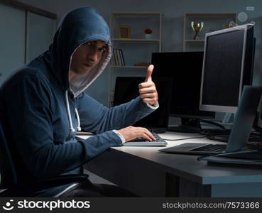 The hacker hacking computer at night. Hacker hacking computer at night