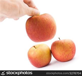 The hand is taking the apple away. Isolated with white background.