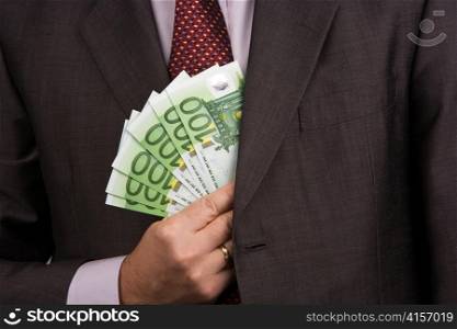 . the hand of a manager with euro banknotes money