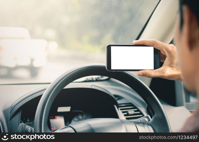 The hand of men are using smartphones in cars, mockup phone, travel ideas and technology.