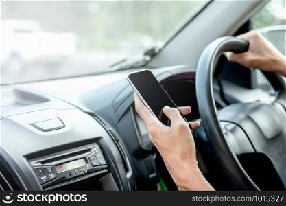 The hand of men are using smartphones in cars, travel ideas and technology.