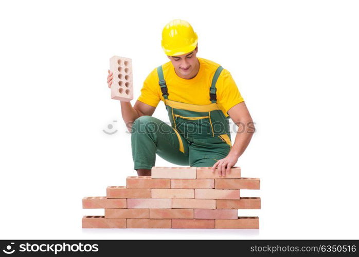 The handsome construction worker building brick wall