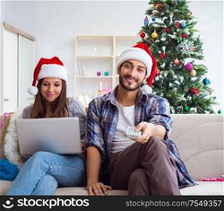 The happy couple celebrating christmas holiday. Happy couple celebrating christmas holiday