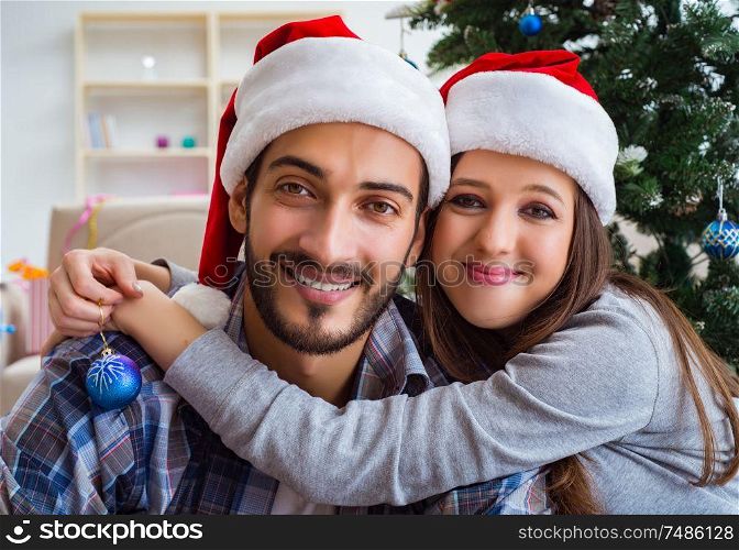 The happy couple hugging during christmas. Happy couple hugging during christmas