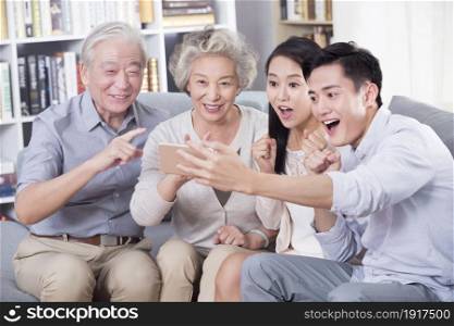 The happy family using their phones