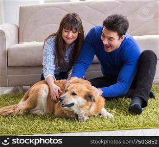 The happy family with golden retriever dog. Happy family with golden retriever dog