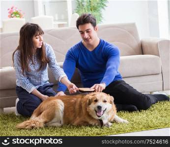 The happy family with golden retriever dog. Happy family with golden retriever dog