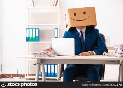 The happy man employee with box instead of his head. Happy man employee with box instead of his head