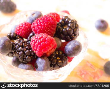 The Happy Time with raspberries, blueberries and blackberries