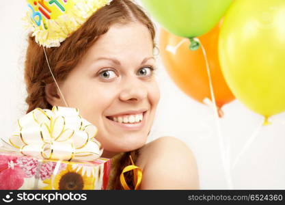The happy young girl with gifts on a white background. Happy Birthday