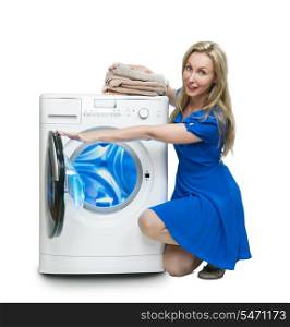 The happy young woman near the new washing machine