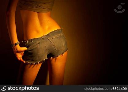 The harmonous girl shows the delightful back in jeans. Hot jeans