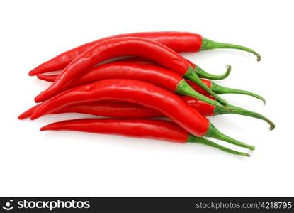 The heap of red hot chili peppers isolated on white background