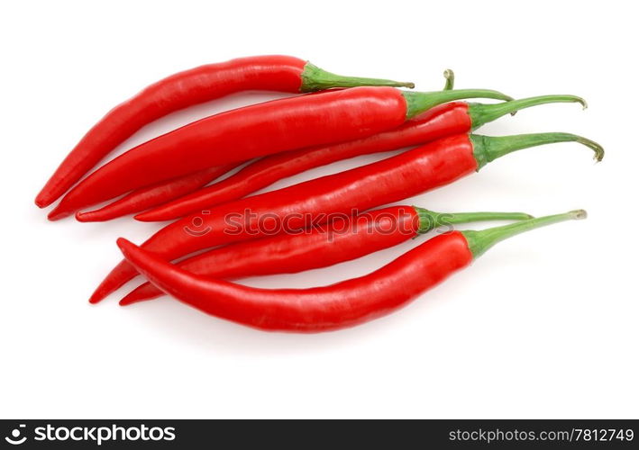 The heap of red hot chili peppers isolated on white background. Red hot chili peppers