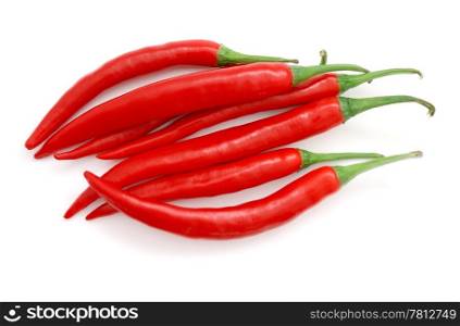 The heap of red hot chili peppers isolated on white background. Red hot chili peppers