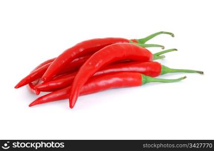 The heap of red hot chili peppers isolated on white background . Red Hot Peppers