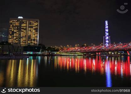 The Helix Bridge in Singapore city at night