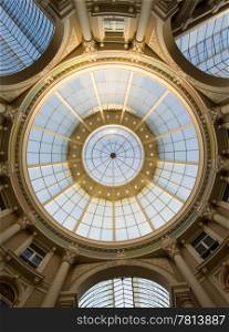 The high dome of a shopping mall with its concentric circles and classic architecture