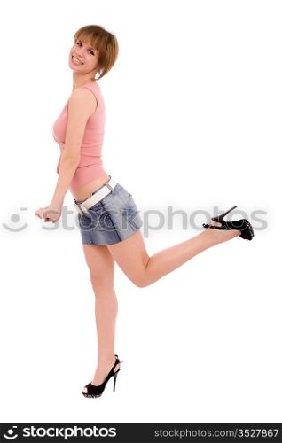 The high long-legged girl in a jeans skirt. isolated on white