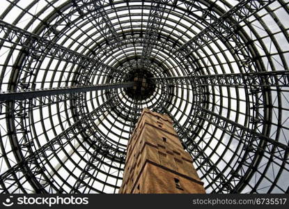 The high, steel-framed, conical-shaped, glass ceiling of a shopping centre