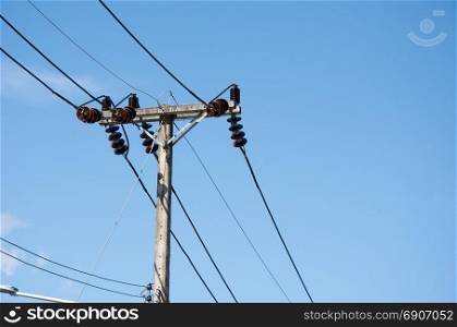 The high-voltage electricity Pole on the sky background.